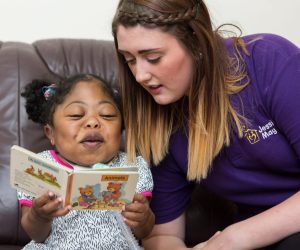 Noon reading with her Jessie May nurse, Charlotte