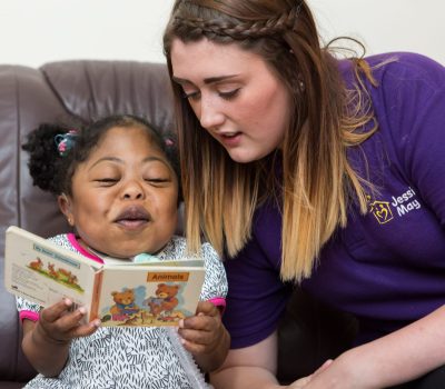 Noon reading with her Jessie May nurse, Charlotte