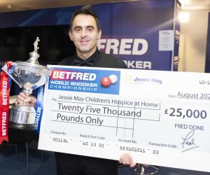 Ronnie O'Sullivan accepts a £25,000 cheque on behalf of Jessie May