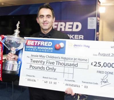 Ronnie O'Sullivan accepts a £25,000 cheque on behalf of Jessie May