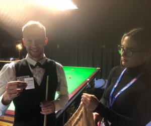 Jessie May ambassador, Judd Trump draws the raffle tickets for the World Snooker Tour World Championship Finals