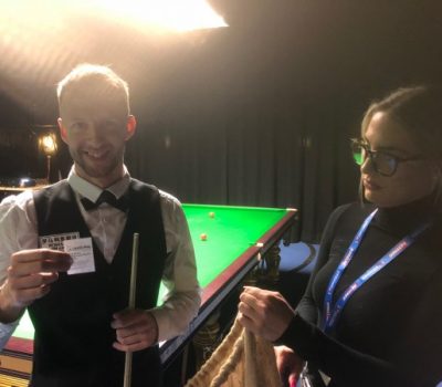 Jessie May ambassador, Judd Trump draws the raffle tickets for the World Snooker Tour World Championship Finals
